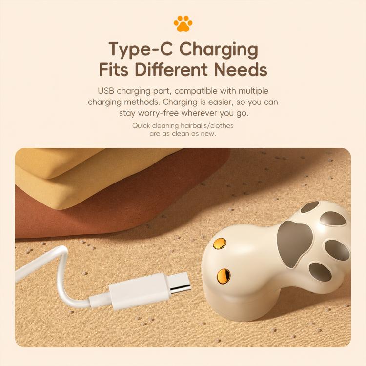 Off-white cat-paw electric lint remover with Type-C charging cable attached.