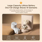 Off-white cat-paw electric lint remover with charging base shown on sofa.