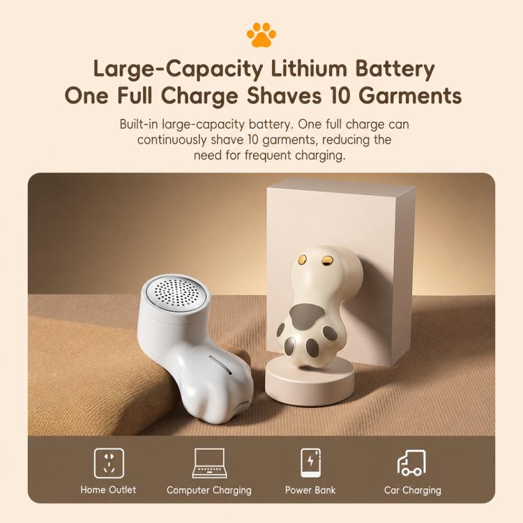 Off-white cat-paw electric lint remover with charging base shown on sofa.