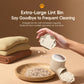 Off-white compact lint remover with cat-paw design and open lint bin cartridge.