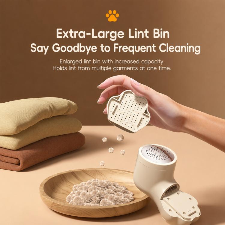 Off-white compact lint remover with cat-paw design and open lint bin cartridge.