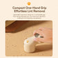 Off-white electric lint remover with one-hand grip, cat-paw pawprint pattern.