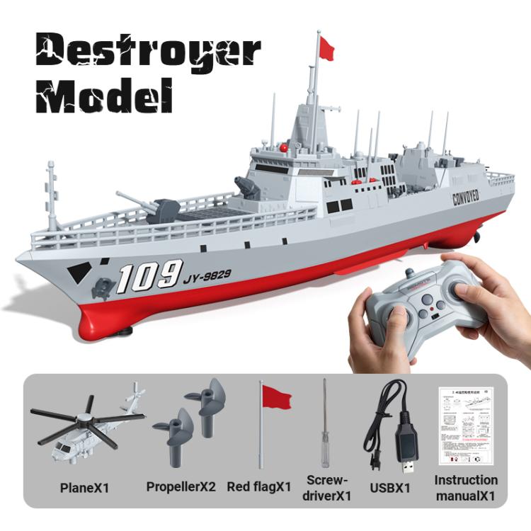 RC destroyer model with gray deck and red bow stripe, remote controller shown
