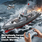 RC destroyer model in ocean waves with remote controller held near bow