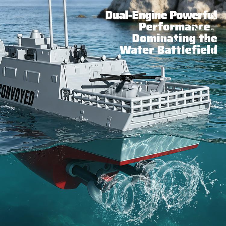 RC destroyer model from side view, gray hull with red trim and splashing water