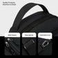 Black crossbody chest bag detail showing metal zippers, strap adjuster, and detachable hook