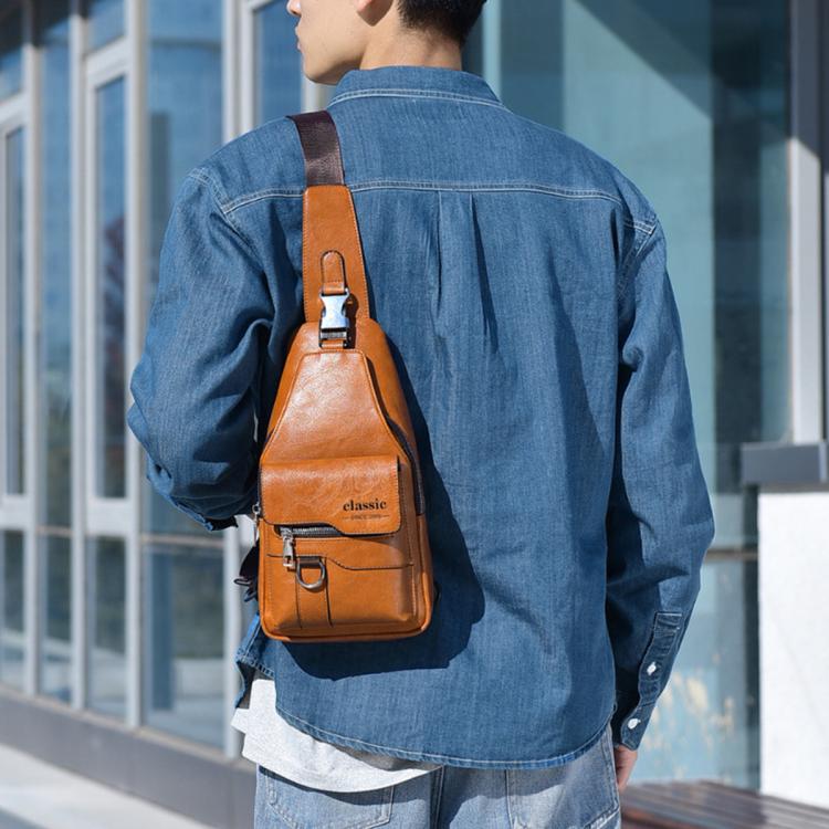 Men's vintage PU leather sling bag in tan with top zipper and adjustable shoulder strap