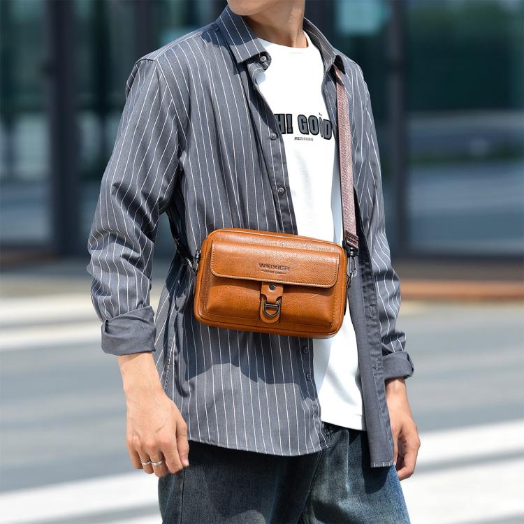 Brown retro shoulder crossbody bag worn on chest, flap with buckle clasp and strap