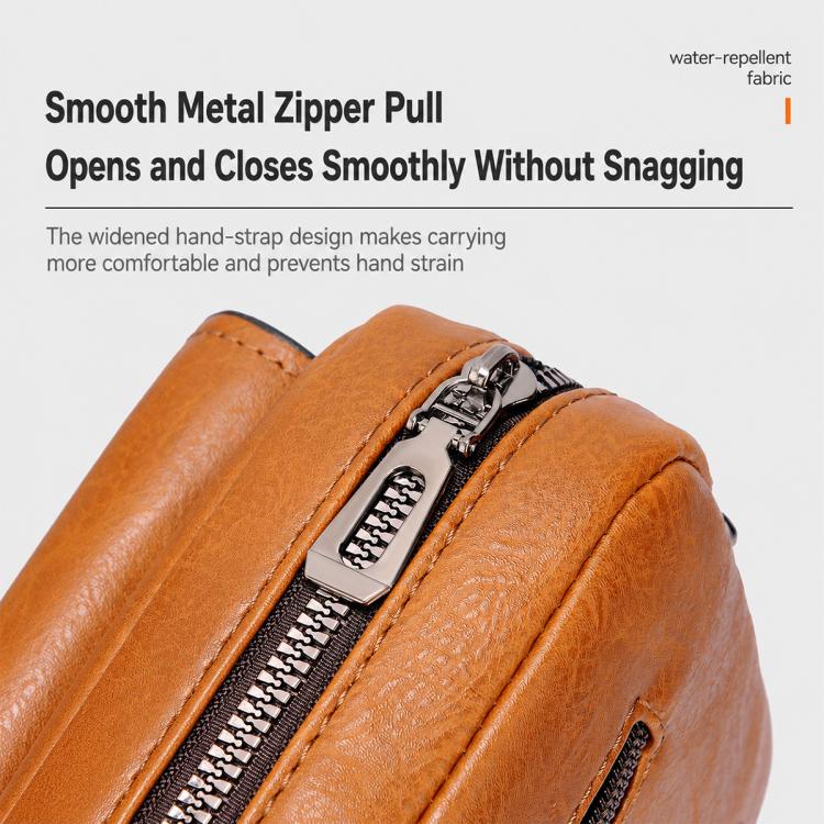 Orange PU leather crossbody sling bag with smooth metal zipper pull, close-up