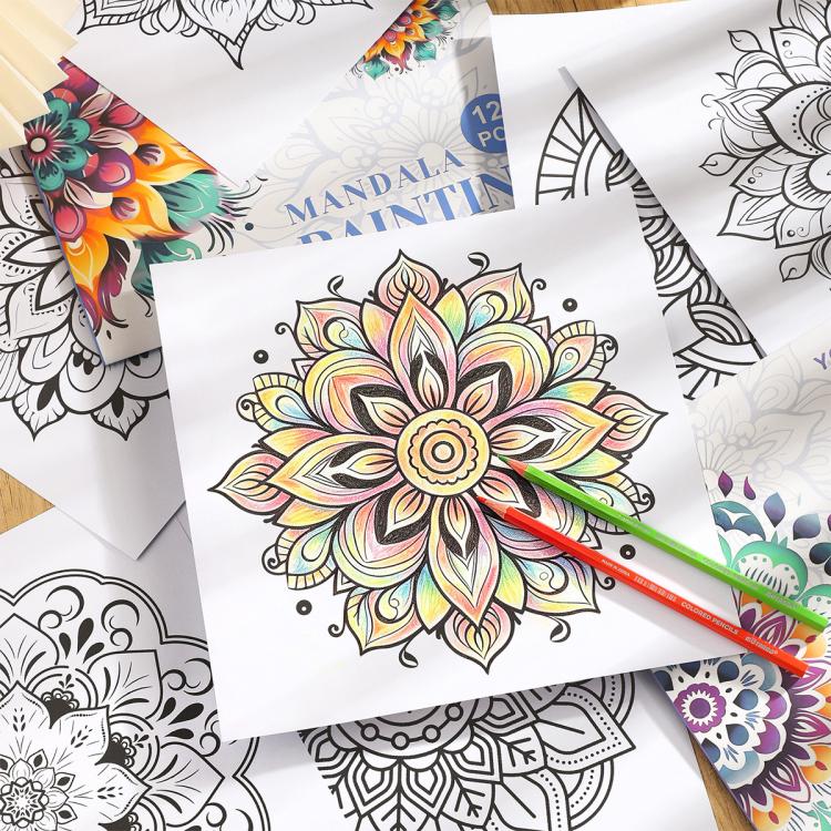 Colorful mandala flower design page with colored pencils on top of other sheets