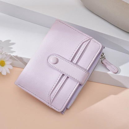 Light purple slim card wallet with coin zipper, litchi texture, wristlet strap