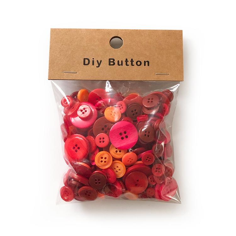 Round resin DIY buttons, red and orange mix in sealed bag