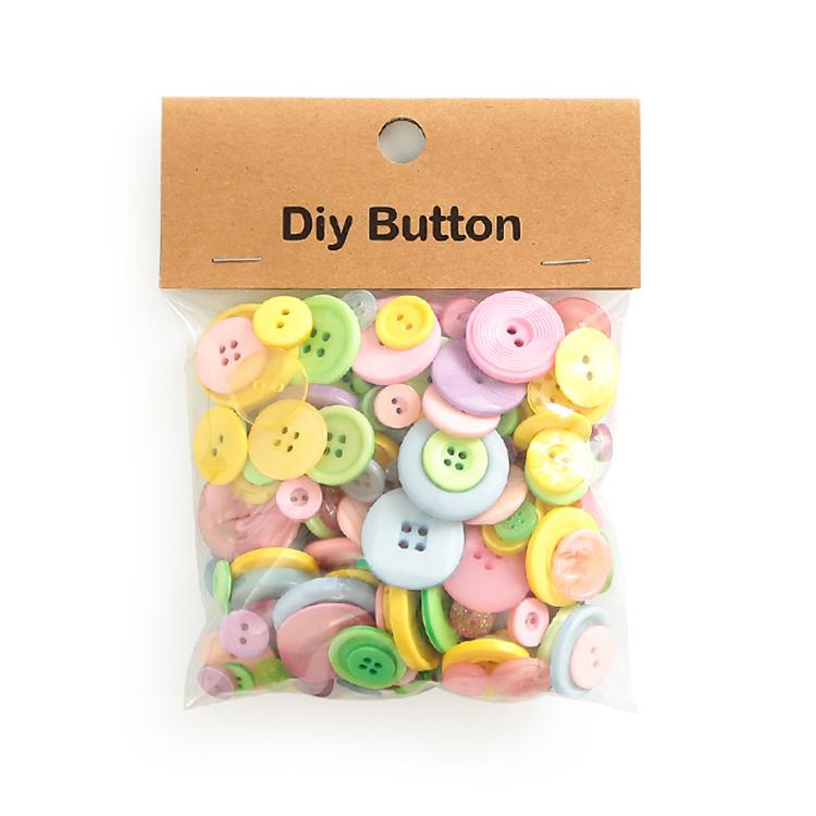 Pack of round resin buttons, pastel pink, green, and yellow mixed sizes with 2-4 holes, clear bag