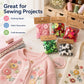 Round resin craft button assortment in multiple colors, next to fabric and yarn