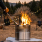 Outdoor camping flame gun with stainless nozzle and wood handle burning over fire pit