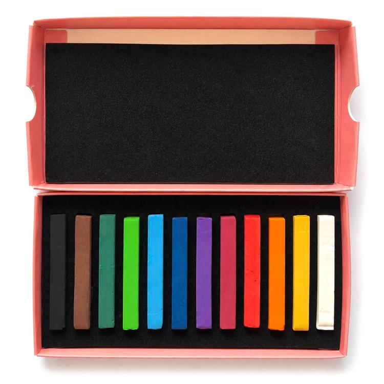 Pastel chalk sticks set in open box, assorted multicolor rectangular sticks on tray.