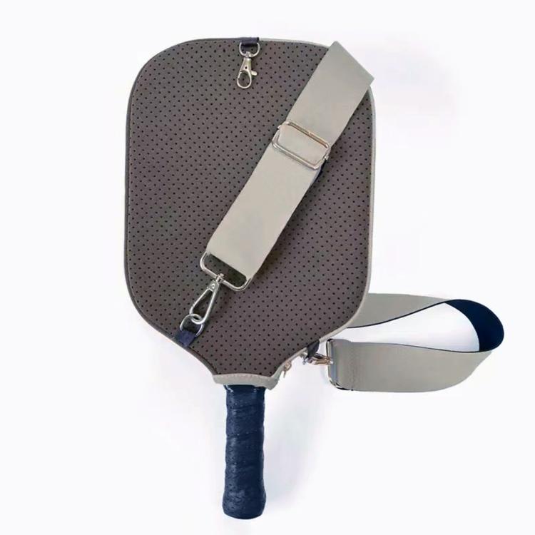 Dark gray perforated neoprene paddle bag with light gray adjustable shoulder strap.