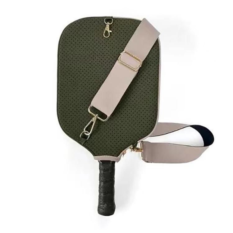 Dark green perforated neoprene paddle bag with beige shoulder strap and metal hooks.