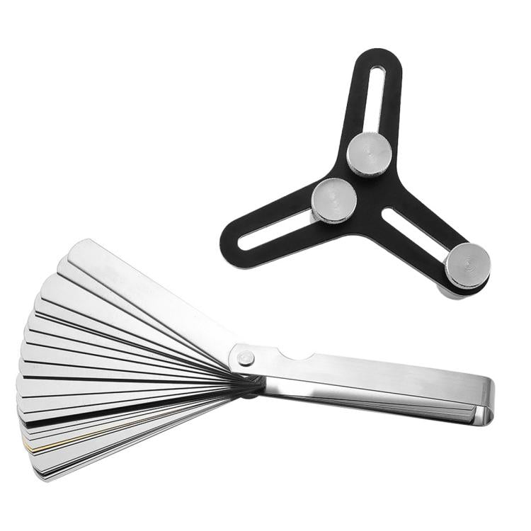 Piston ring squaring tool with silver ribbed feeler gauge and three anvils