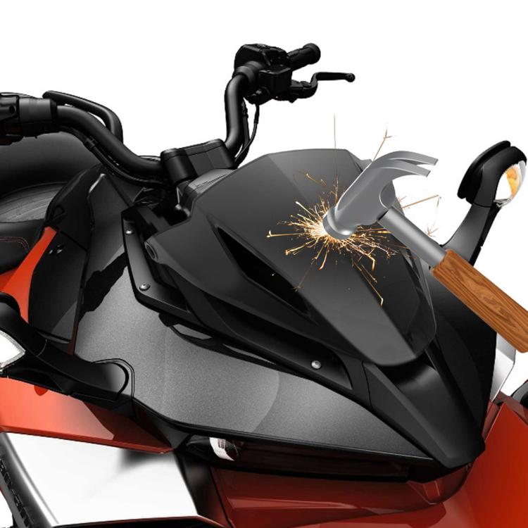 Smoked dashboard cowl on motorcycle with spark and impact effect near the cowl