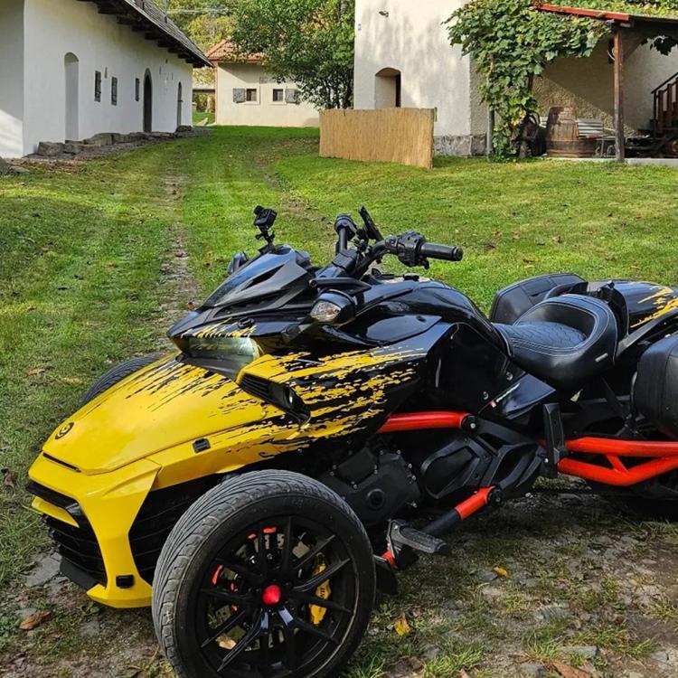 Smoked dashboard cowl on a Can-Am Spyder trike, black tinted front cover