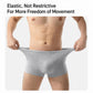 Men's grey disposable boxer briefs on model, elastic waistband and roomy stretch fit.