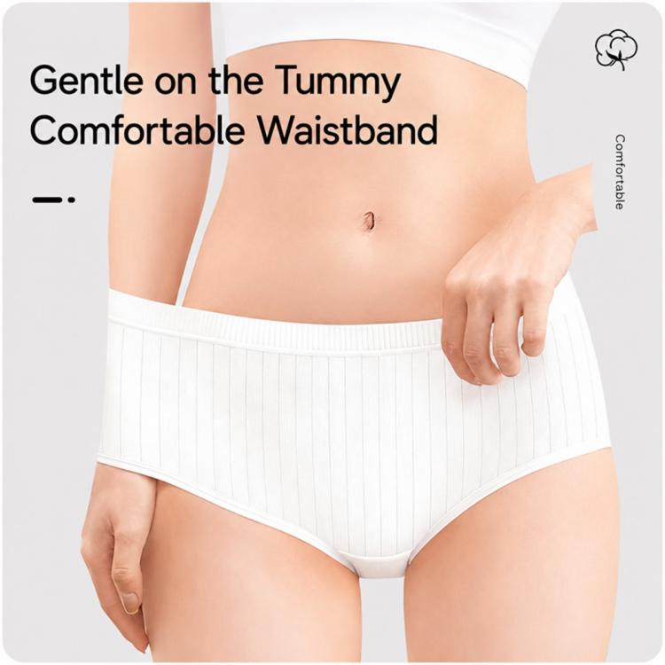 Women disposable brief underwear, white, gentle elastic waistband close-up over tummy area
