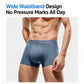 Men's blue-gray boxer briefs on model, showing wide waistband