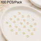 Gold open jump rings, small split rings laid out for DIY jewelry making