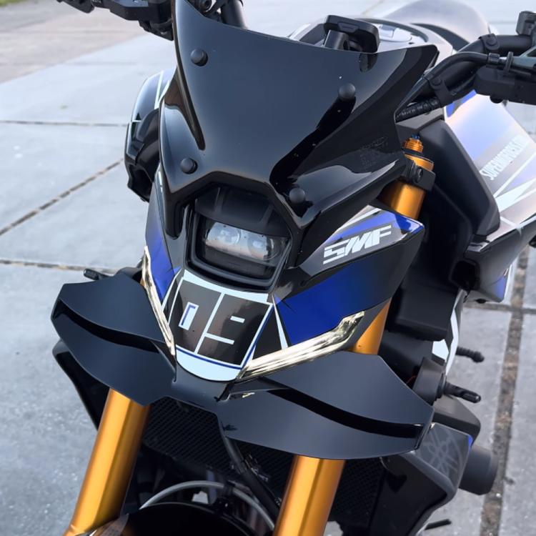 Motorcycle front winglet in matte black mounted on the front fairing