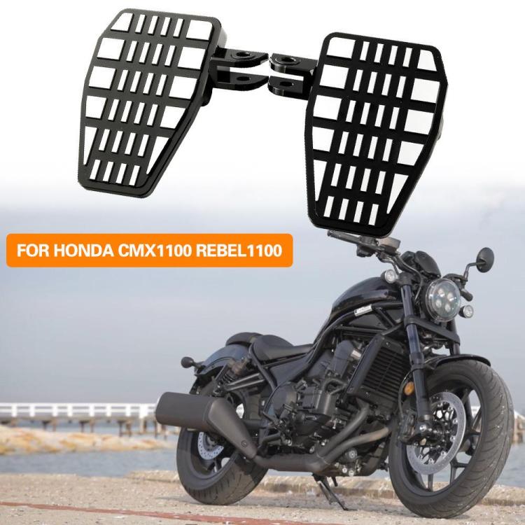 Motorcycle with black anti-slip widened footrest pedals installed