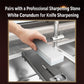 Hand placing a whetstone on a sink bridge sharpener rack over a stainless basin