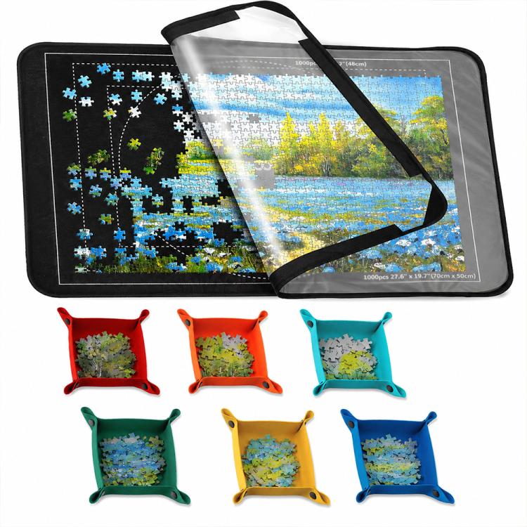 Foldable black puzzle mat with blue jigsaw scene print, open with carry strap, sorting trays included