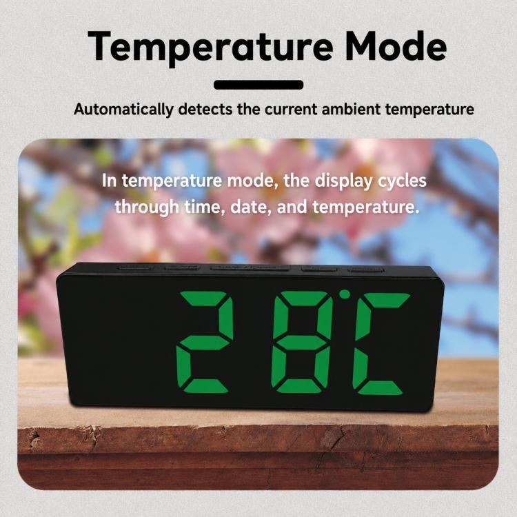 LED digital clock in temperature mode with green digits, black housing