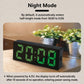 LED digital clock in night mode with green time display, black housing