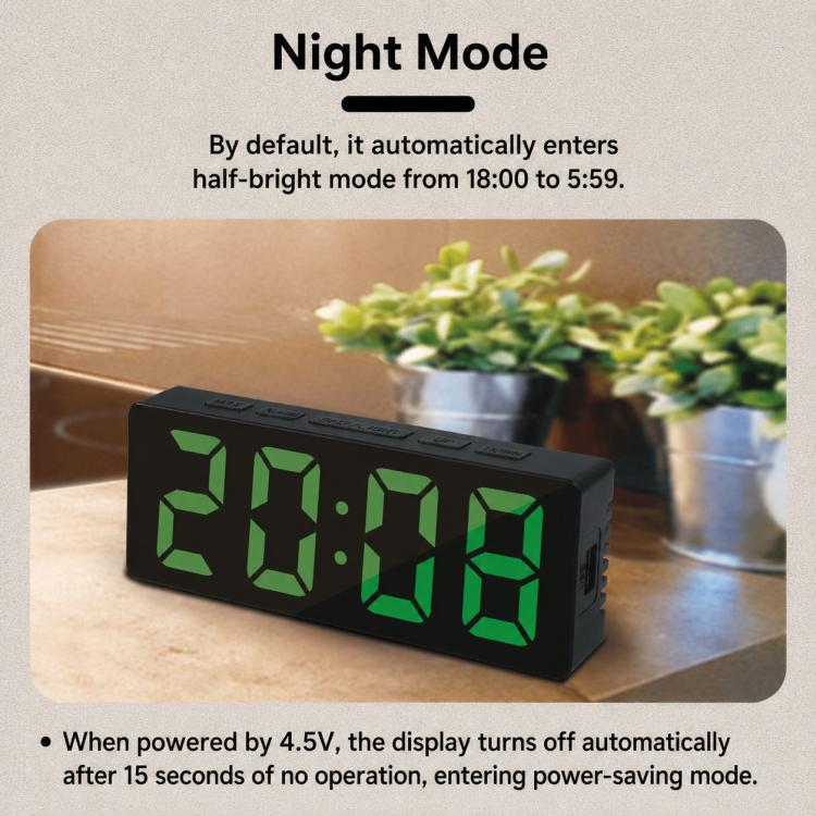 LED digital clock in night mode with green time display, black housing