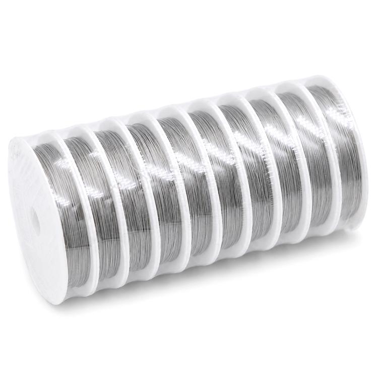 Stainless steel beading wire spool with shiny silver coils on a white plastic roll