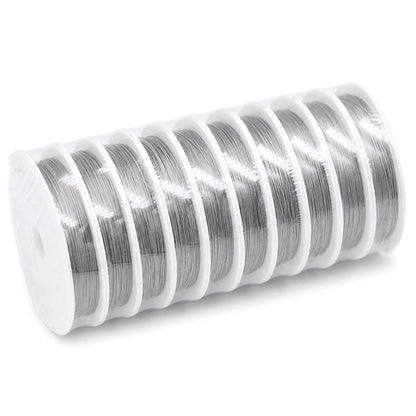 Stainless steel beading wire spool with shiny silver coils on a white plastic roll