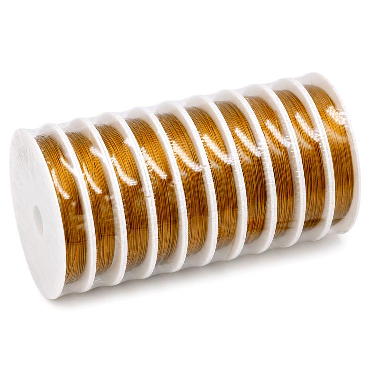 Stainless steel beading wire spool with gold coils wound on a white plastic roll