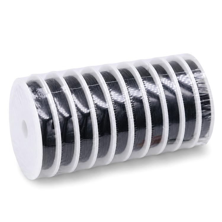 Beading wire spool with dark black coils wound on a white plastic roll