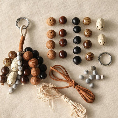 Natural seed bead strand set with mixed wooden and dark beads, cords, and rings