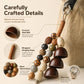 Natural bead bag charm components with shell bells, wrapped cord, and metal clasp