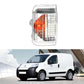 Turn signal light with clear plastic lens, orange reflector section, and LED grid