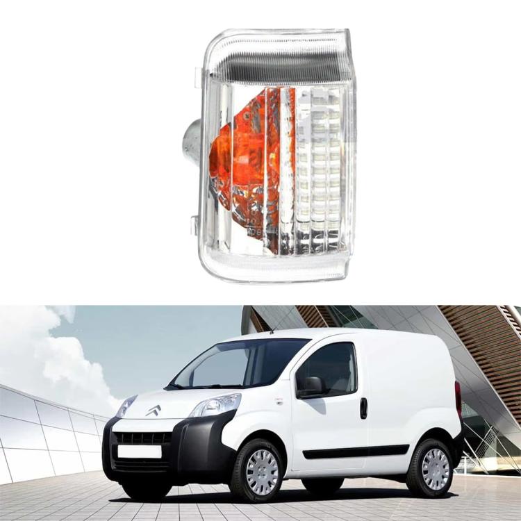 Turn signal light with clear plastic lens, orange reflector section, and LED grid
