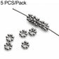 Silver-tone flower-shaped spacer beads with center holes, 5-pack on a pin