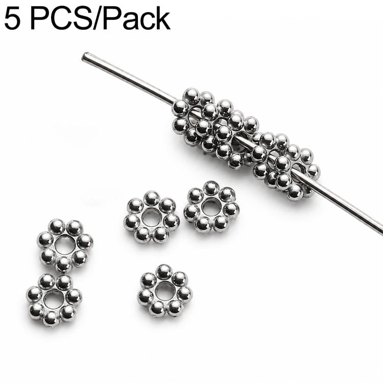 Silver-tone flower-shaped spacer beads with center holes, 5-pack on a pin