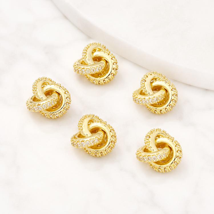 Gold-tone heart-shaped zircon inlaid spacer beads with sculpted loop and sparkle trim