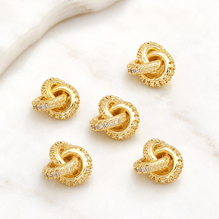 Gold-tone heart-shaped zircon inlaid spacer beads, detailed loop center and border stones