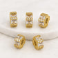 Gold-tone square zircon spacer beads with clear center stones, textured rim