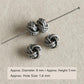 Textured twisted dark silver bead spacers on a pin, with small hole size